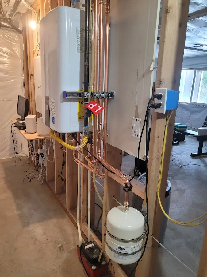 Licensed plumber repairing a kitchen sink in McLean